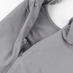 V neck shapewear bodysuit grey close-up showing zipper and hook design, highlighting secure closure and supportive compression structure