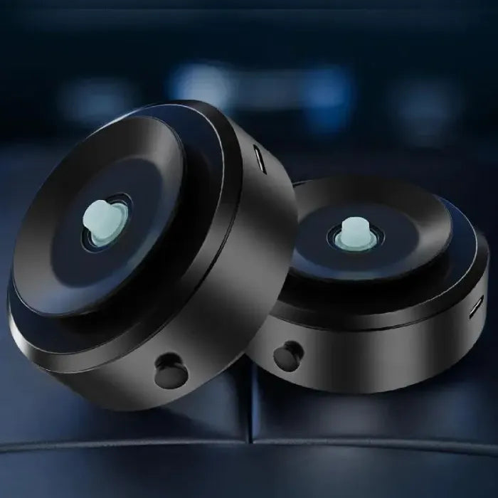 Two black circular devices with blue center buttons showcasing vacuum adsorption technology for strong suction