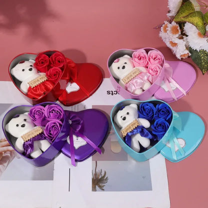 Collection of colorful heart gift boxes with teddy bears and roses on pink background