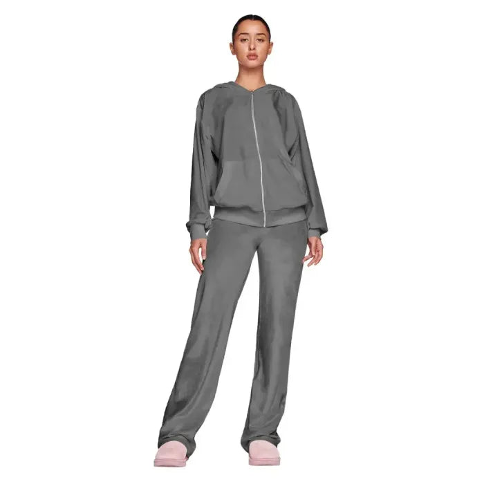 Velour tracksuit in gray featuring a full zip hoodie and straight leg pants designed for cozy lounge and travel wear