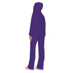 Velour tracksuit back view in purple showing draped hood and relaxed pants for plush comfort and easy layering