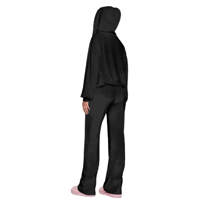 Velour tracksuit back view in black highlighting a draped hood and relaxed fit pants for smooth everyday comfort