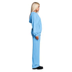 Velour tracksuit in sky blue shown from the side with a relaxed zip hoodie and wide leg pants for soft all day comfort