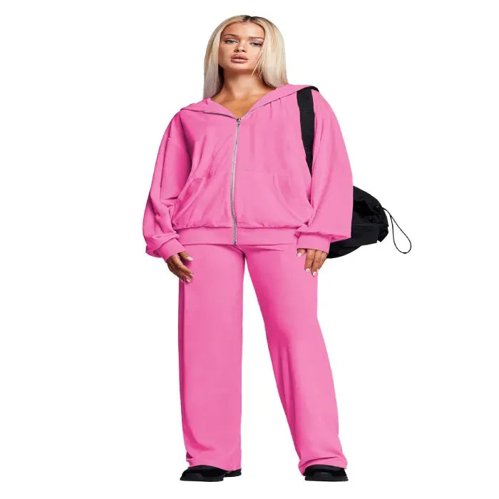 Velour tracksuit in pink with a full zip hoodie and straight leg pants designed for cozy lounging and stylish everyday wear