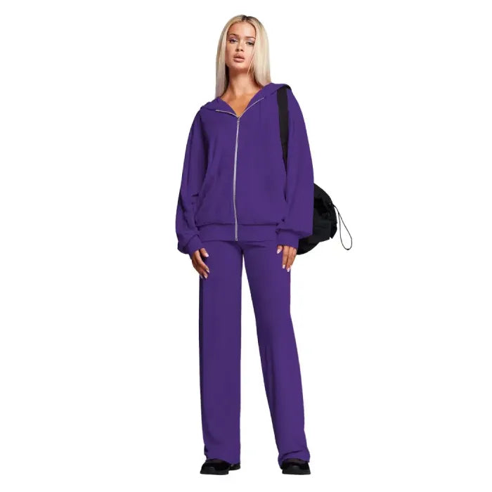 Velour tracksuit in purple featuring a relaxed zip hoodie and wide leg pants for bold color and soft comfort