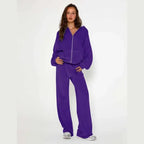 Velour tracksuit in royal purple worn as a matching set with zip hoodie and wide-leg pants for bold street style