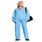 Velour tracksuit in sky blue featuring a relaxed zip hoodie and wide leg pants for soft comfort and elevated casual wear