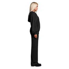 Velour tracksuit side view in black featuring a relaxed hoodie and straight pants for minimal look and comfy wear