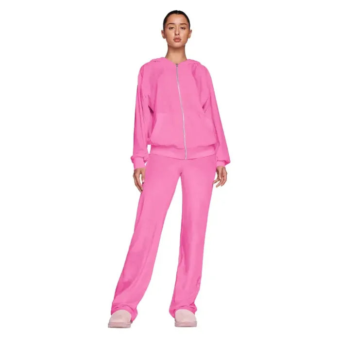 Velour tracksuit in hot pink with full zip hoodie and wide leg pants for cozy loungewear, travel, and daily errands