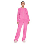 Velour tracksuit in hot pink with full zip hoodie and wide leg pants for cozy loungewear, travel, and daily errands