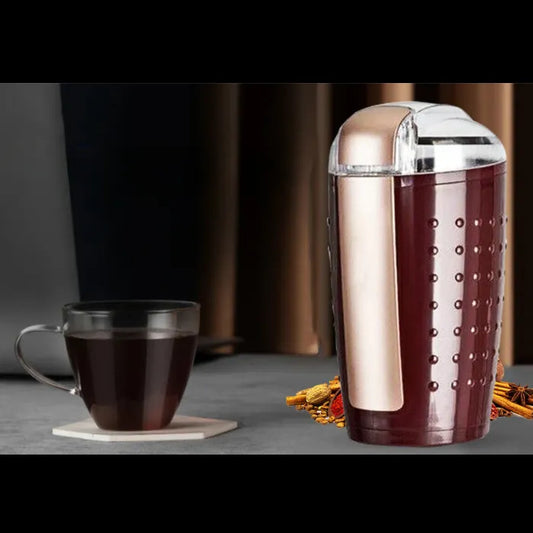 Electric grinder with coffee beans, spices, and nuts display