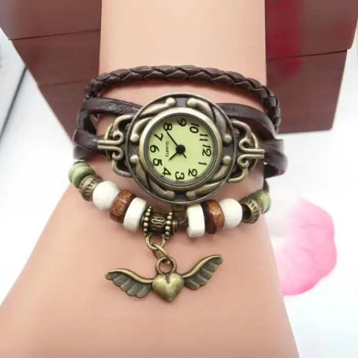 Vintage brown leather wrap bracelet watch with heart charm and beads for women’s bohemian fashion.