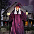 Voice-controlled Halloween witch decoration with glowing red eyes and long purple robe on white background