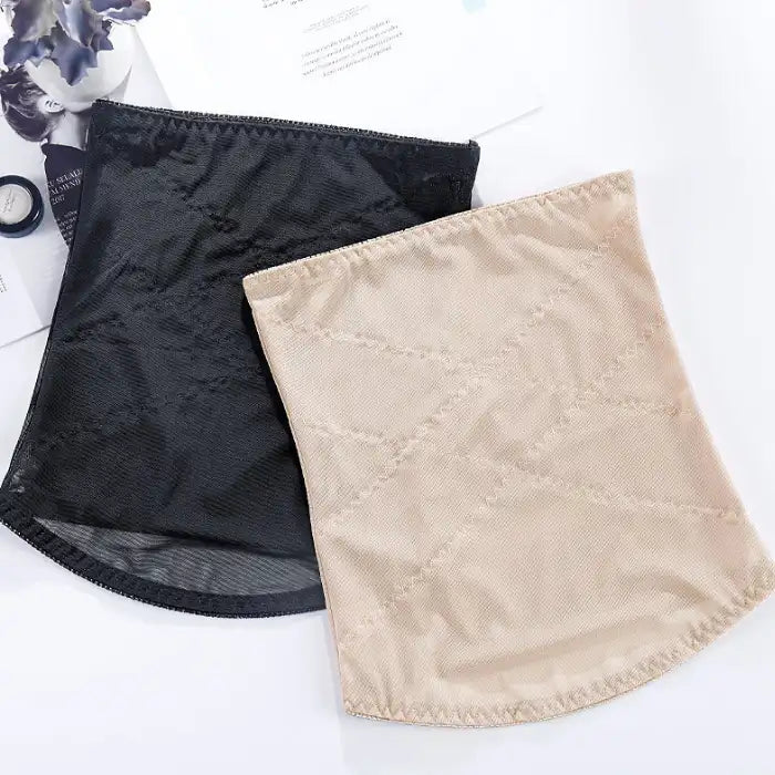 Waist cincher shapewear in beige and black color options laid flat on a table