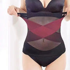 Waist cincher shapewear in black and red stretched to show cross-compression support