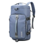 Waterproof blue-gray duffle bag featuring large front pocket, gray straps, and convertible backpack design.