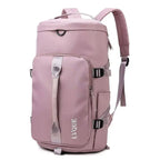 Waterproof duffle bag in mauve pink with gray straps and front pocket for versatile travel use.