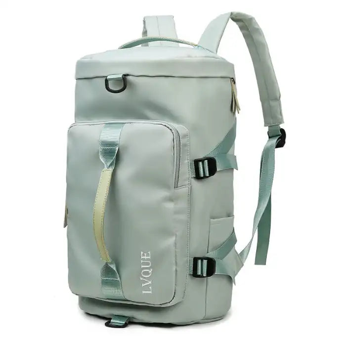 Waterproof mint-colored duffle bag with front pocket and adjustable shoulder straps for travel use.