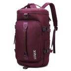 Waterproof duffle bag in wine red with front grab handle and sleek travel-ready design.