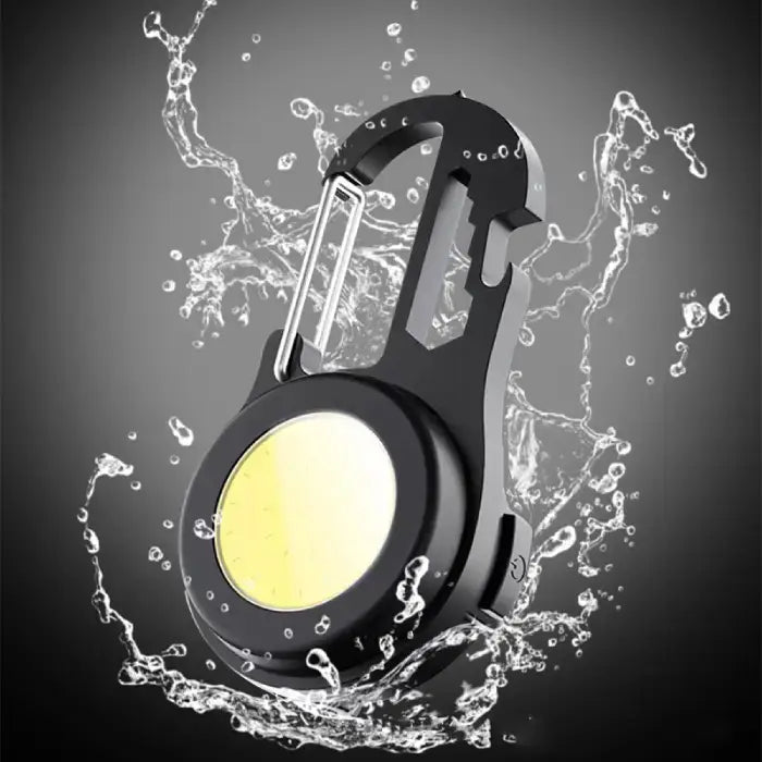  Water splash demonstration showing waterproof capability of black LED carabiner light