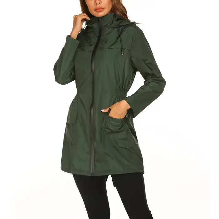 Waterproof Raincoat dark green women’s parka with hood, cinched waist and zip front.