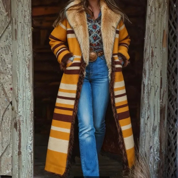 Western-style faux fur trimmed coat in mustard stripes with vintage denim and embroidered shirt, rustic backdrop.