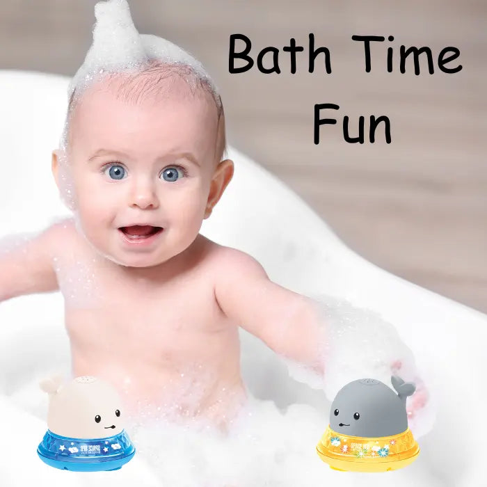 Baby playing with whale bath toy in bathtub surrounded by foam and bubbles.