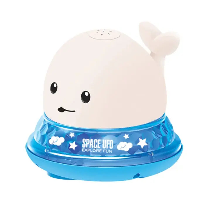 White whale bath toy with blue light-up UFO base and fun star pattern.