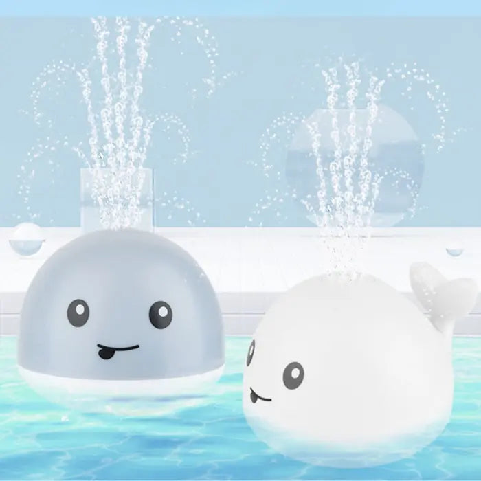 White whale bath toy with 11x10x9cm size dimensions labeled on the image.