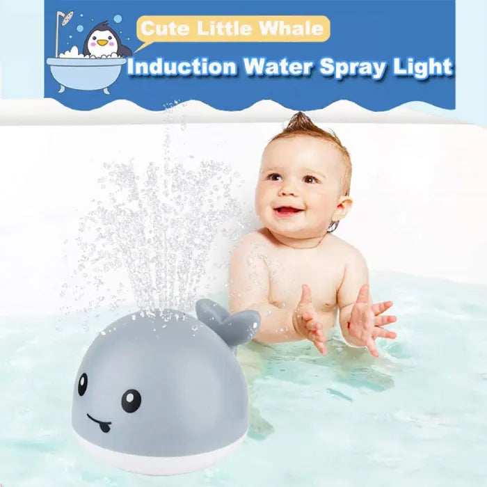 Gray and white whale bath toys by the poolside, with one spraying water while floating.