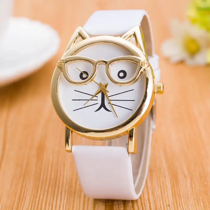 Minimalist white strap wristwatch with gold cat-ear detail and a white dial featuring a cute cat face design.