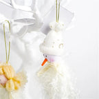 white christmas ornaments snowman closeup on white tree, plush with gold bells and carrot nose, neutral xmas decor looks