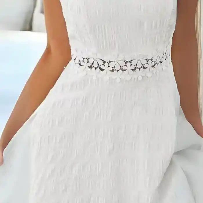 White crochet spaghetti strap dress close‑up on floral waist lace detail and texture