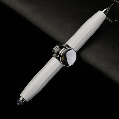 White fidget spinner pen with a chrome center on a black leather background.