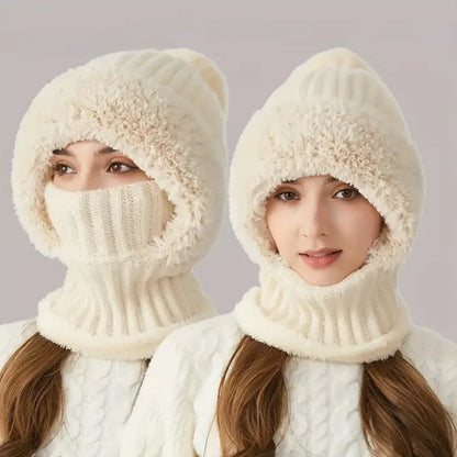 Two people wearing white fuzzy knit winter hats with attached neck warmers that cover their face up to their eyes 