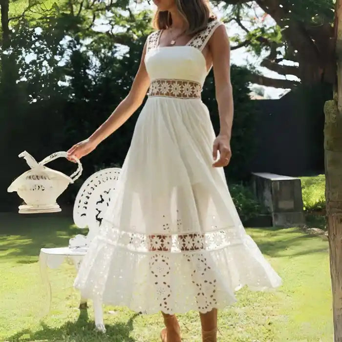 White lace midi dress with tiered lace hem twirling under tree shade.
