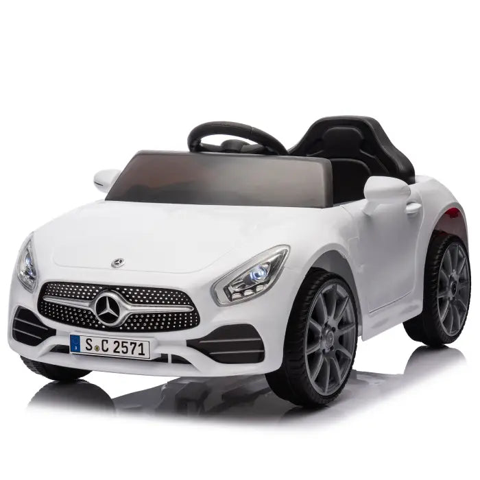 White luxury kids' ride-on car with realistic design, featuring detailed headlights and wheels.