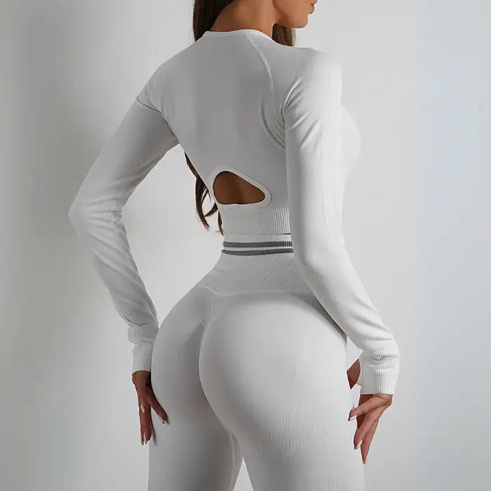 White seamless activewear with cutout back crop top and high-waisted leggings