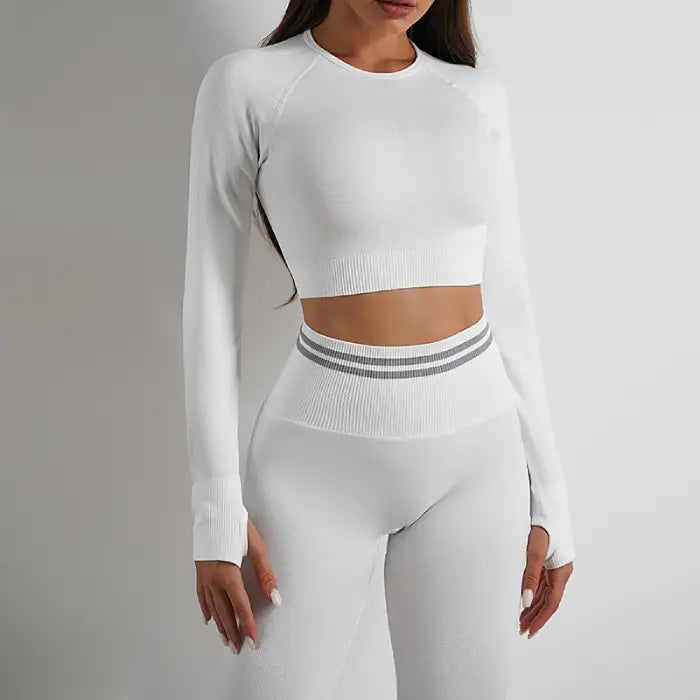 All-white seamless gym set with long-sleeve crop top and compression leggings for women
