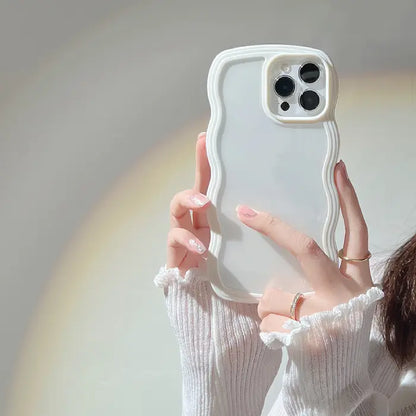  A white wavy frame iPhone case held by a hand with light ruffled clothing.