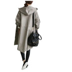 Windbreaker Trench Coat in gray shown from the back paired with black leggings and handbag