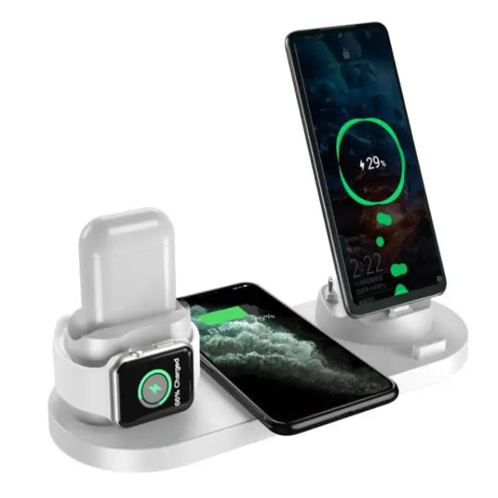 Wireless fast charging station in white with three devices docked and charging simultaneously