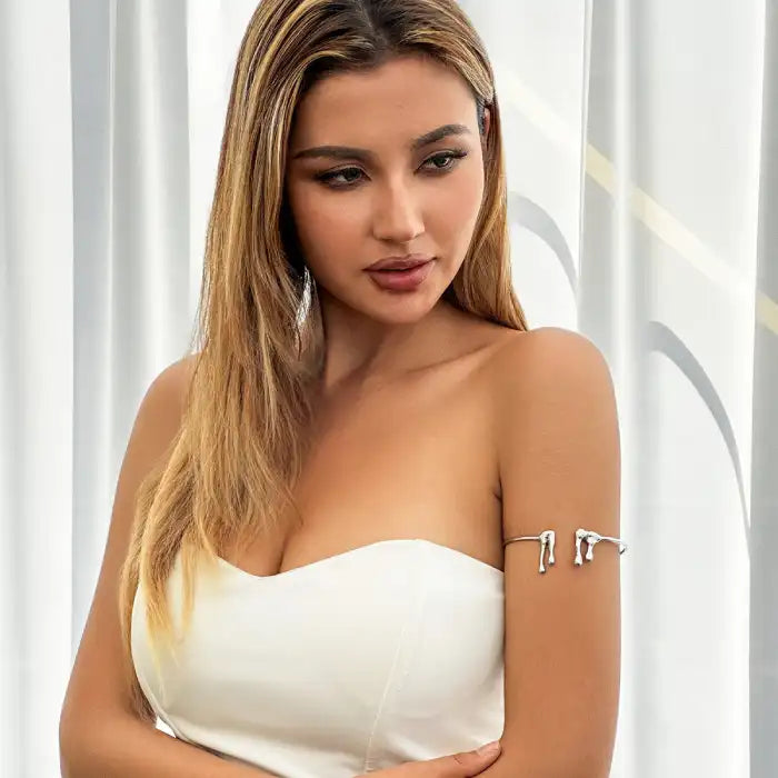 women wearing silver drip style arm band with abstract ends