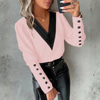 womens contrast v neck long sleeve blouse black trim in soft pink paired with leather pants for a chic feminine outfit style