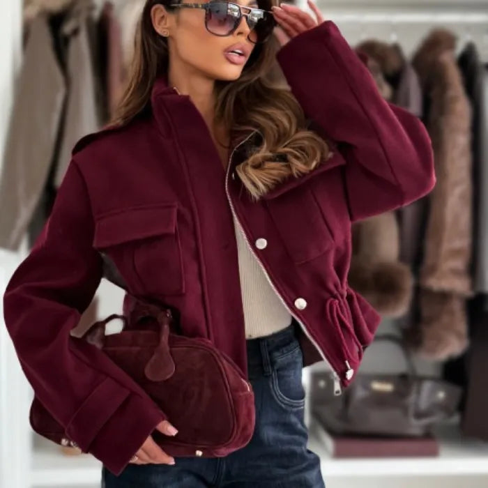 Women's cropped utility jacket in burgundy with structured design and functional pockets, elevating fall fashion looks