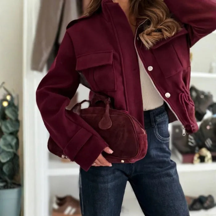 Women's cropped utility jacket close-up highlights zip closure, flap pocket and tailored sleeves for premium comfort