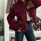 Women's cropped utility jacket close-up highlights zip closure, flap pocket and tailored sleeves for premium comfort