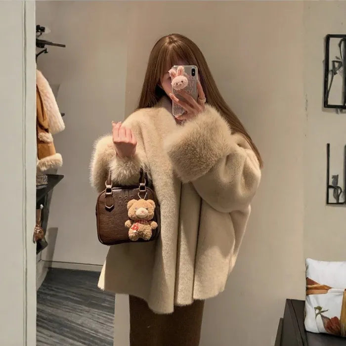 womens faux fur coat styled with handbag and neutral tones creating a premium winter fashion look with warmth