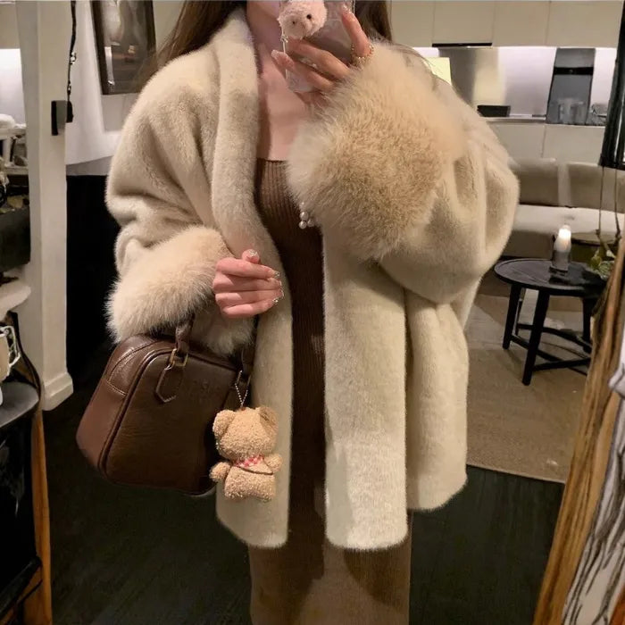 womens faux fur coat worn in a modern winter outfit featuring plush texture elegant drape and cozy warmth