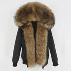 Womens fox fur parka with oversized hood in black with brown fur, emphasizing luxe texture and cozy winter comfort for cold days